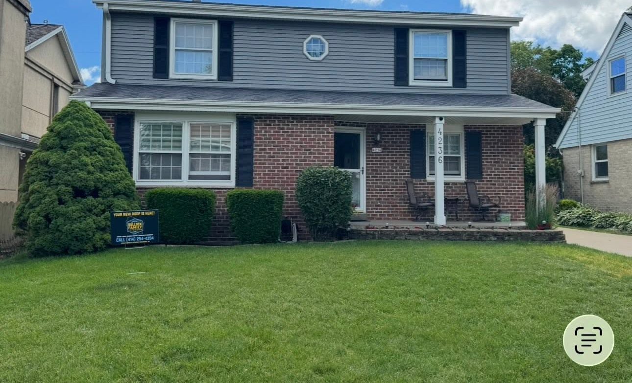 Same home with new gray siding after Evergreen Exteriors