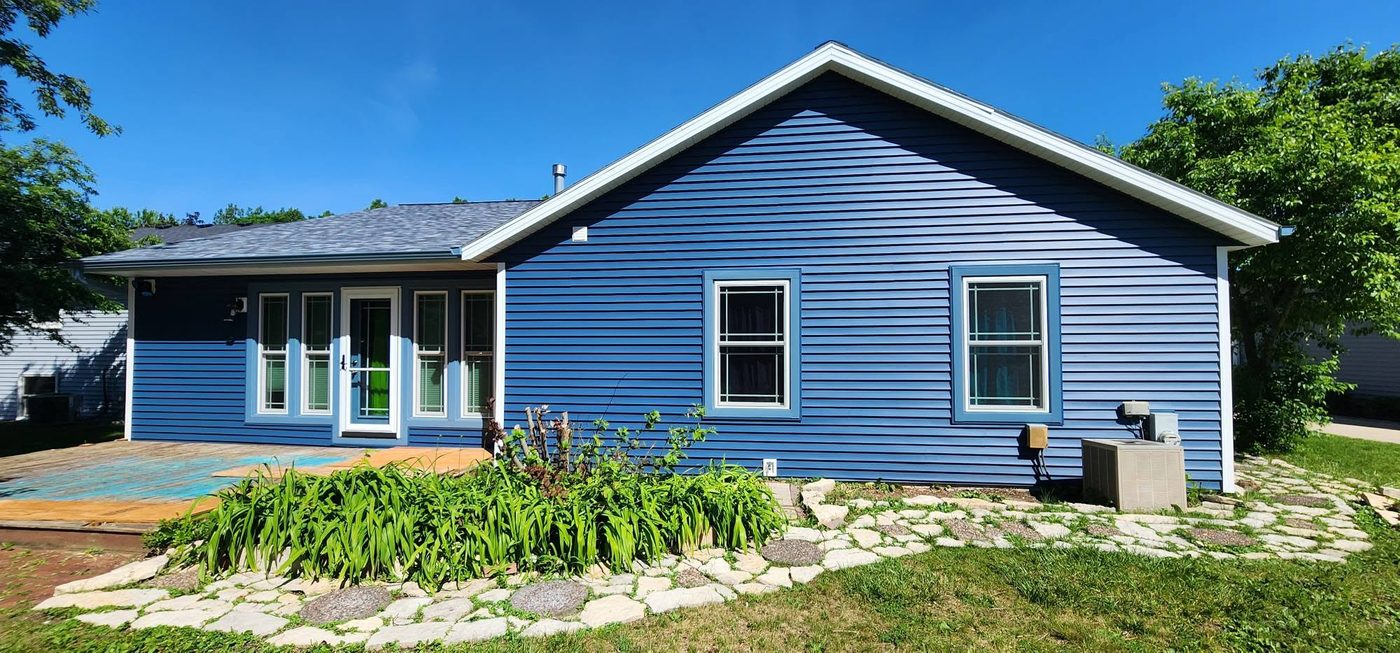 Same home with fresh blue siding after Evergreen Exteriors